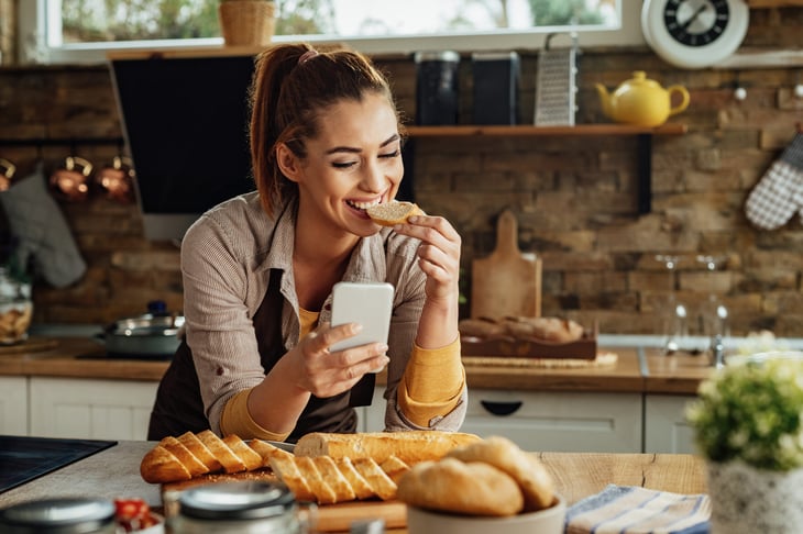 Woman eating bread