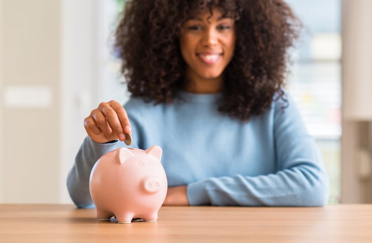 Woman with piggy bank
