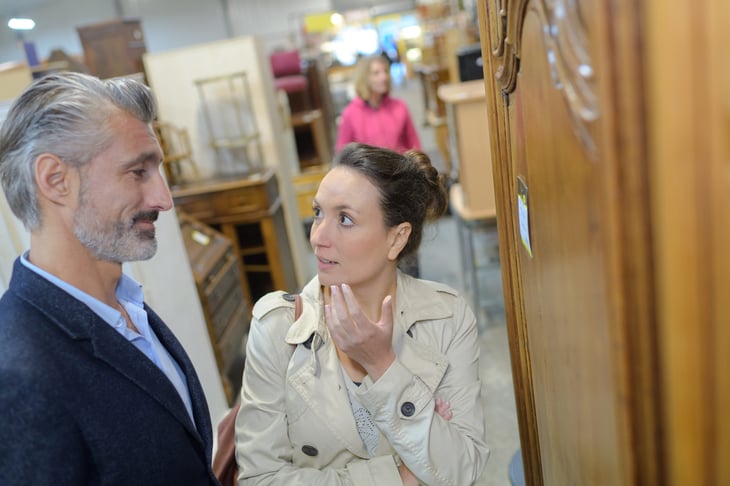 couple shopping for furniture in a secondhand store