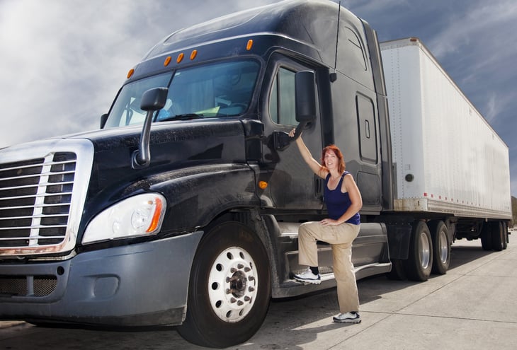 A female truck driver with a tractor-trailer