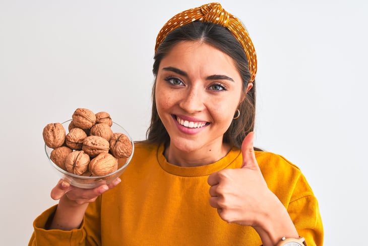 Woman holding walnuts