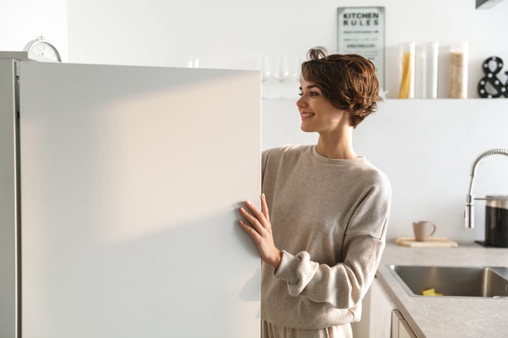 woman opening a freezer
