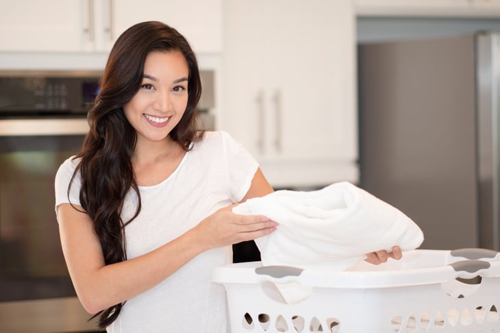 Woman folding the laundry