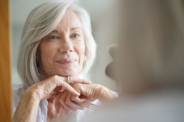 Senior woman looking in the mirror