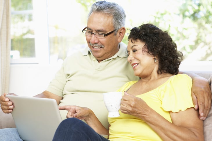 Latino couple at computer
