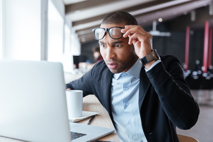 Surprised man at computer
