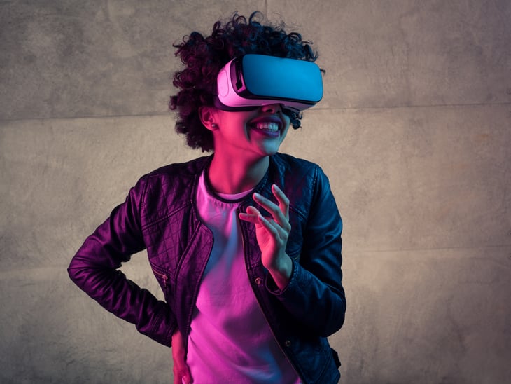 A woman uses a virtual reality headset