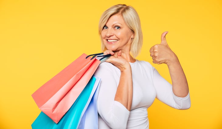 Woman shopping gives thumbs up