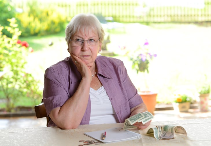 Older woman counting money