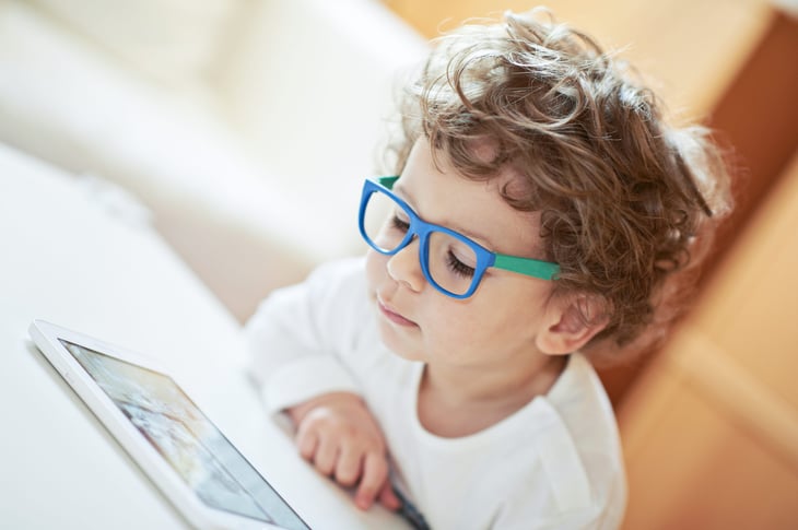 Boy reading tablet