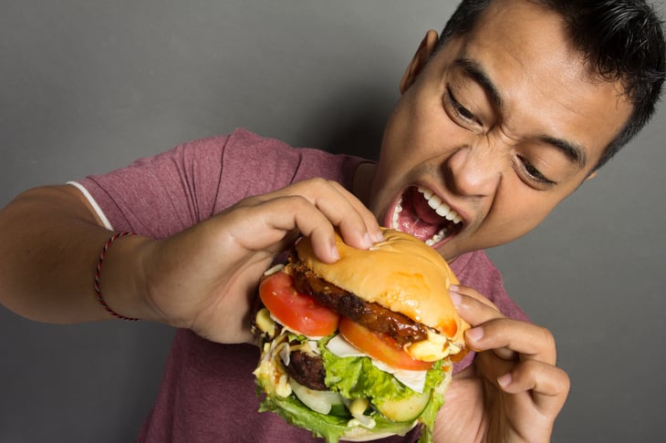 Man eating hamburger