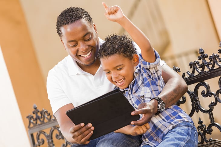Father and son on tablet