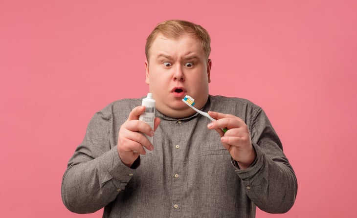 Man with toothpaste
