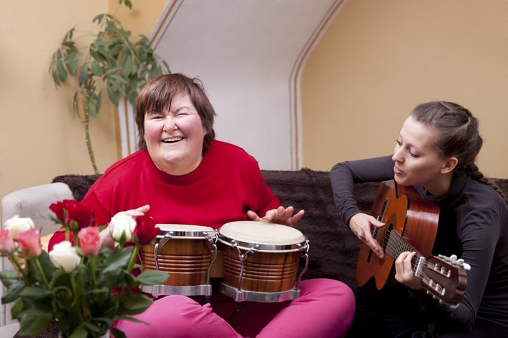 Two women playing musical instruments