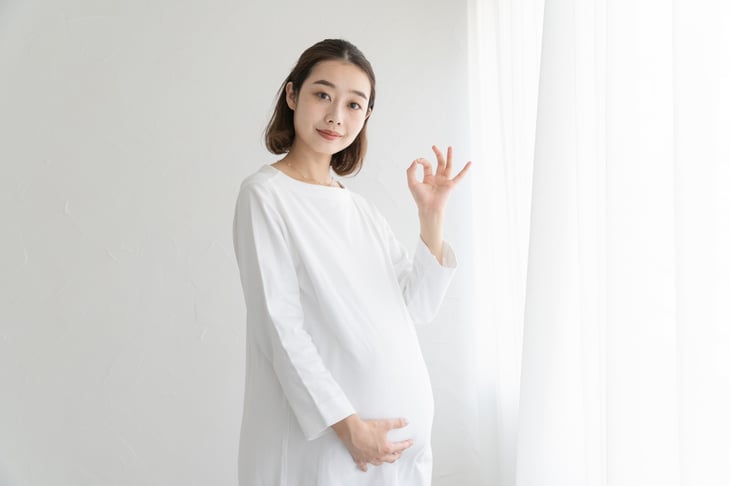 pregnant woman in white room