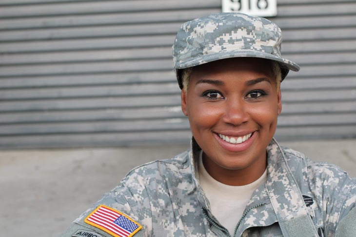 Woman veteran military service member smiling