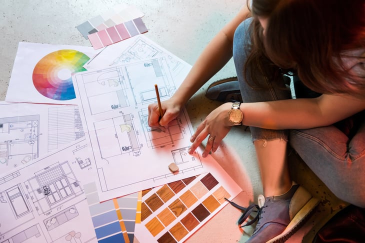 Interior designer draws plan with art tools