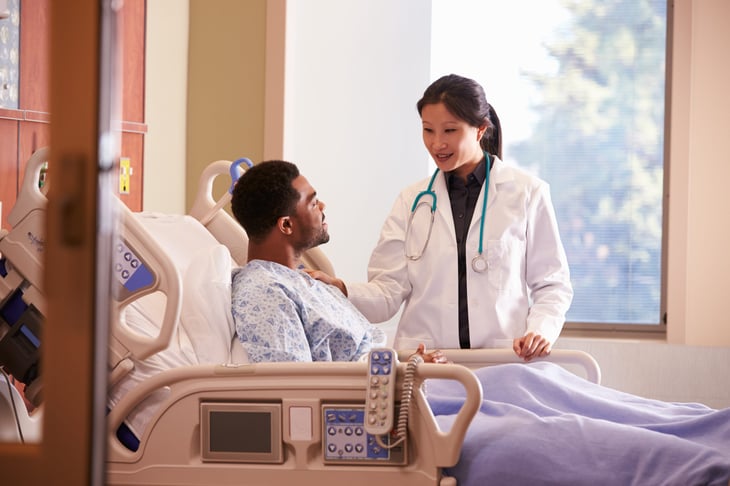 Doctor caring for a hospital patient