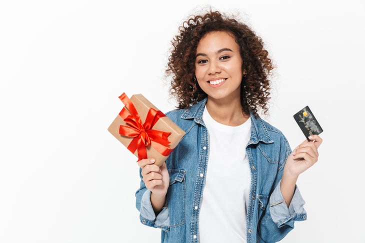 Woman with a gift and credit card