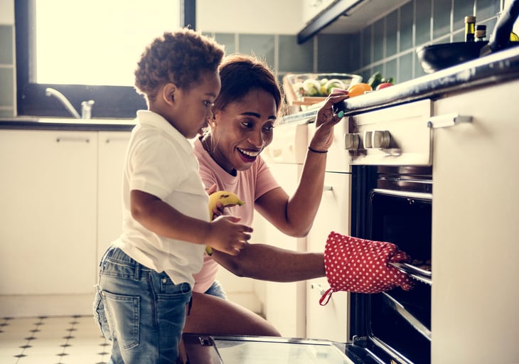 Mother baking cookies with her son