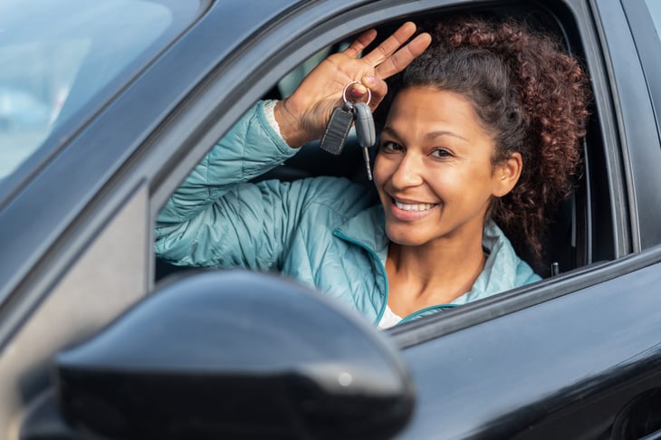 woman in a gently used car