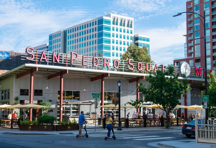 People ride electric scooters in San Jose, California.