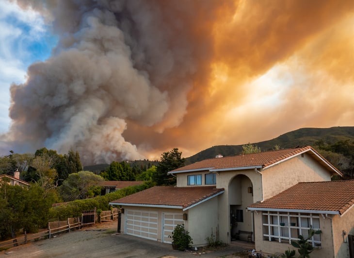 Wildfire approaching a house