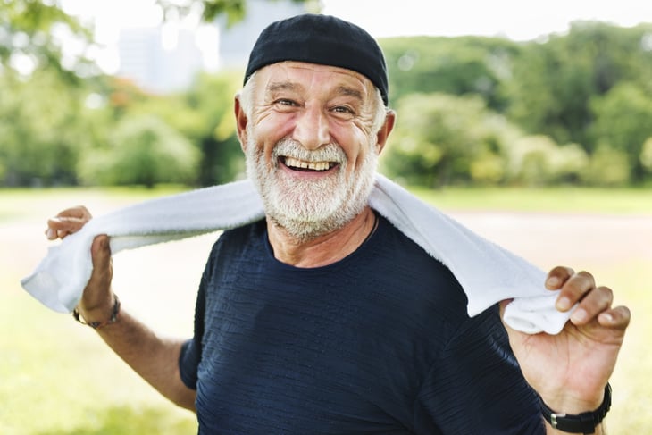 Happy older man exercising