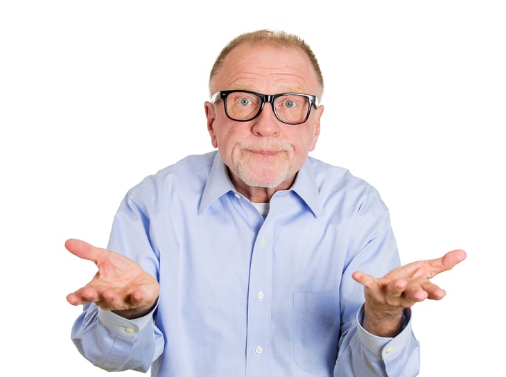 Senior man shrugging