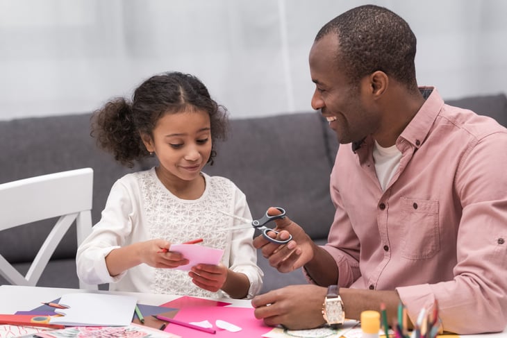 A father and daughter make homemade greeting cards