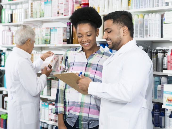 Pharmacist explains a prescription to a patient