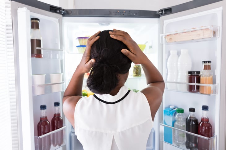 woman looks for staple cooking ingredients