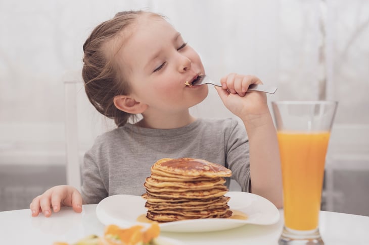 Girl eating pancakes