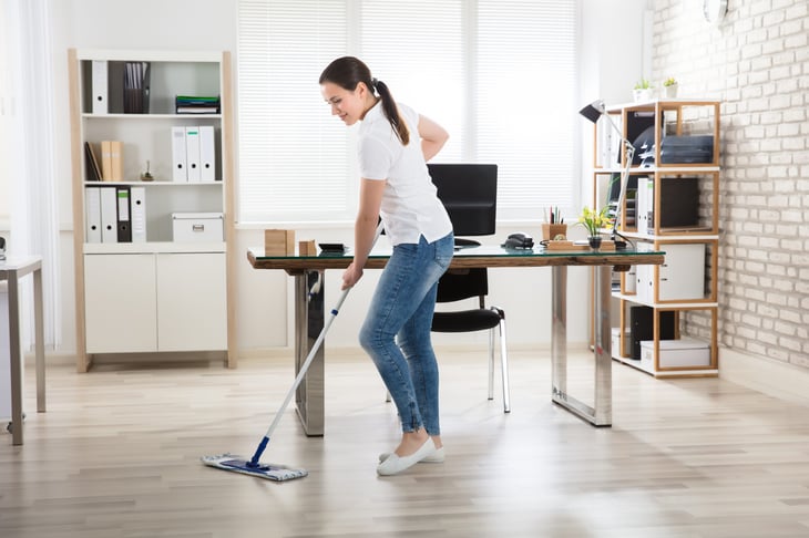 Woman mopping an office