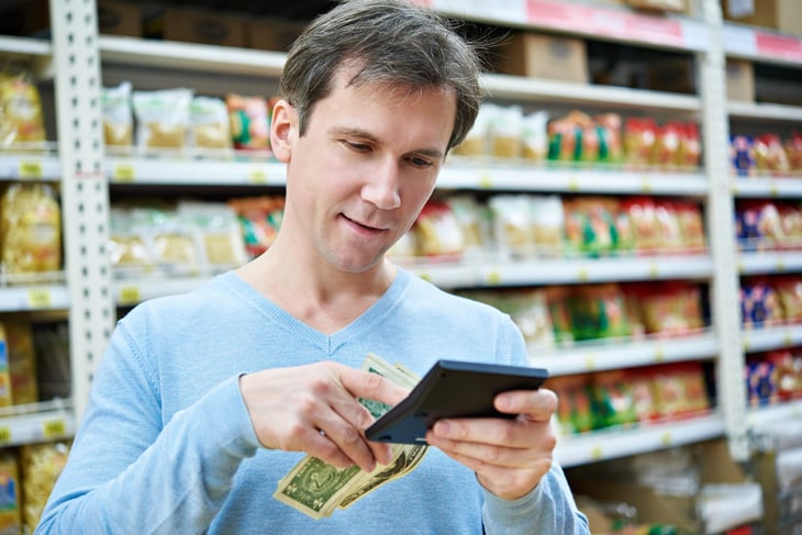 Man shopping at a dollar store