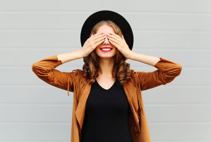 woman covering her eyes