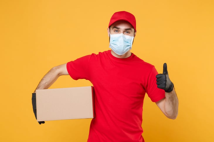Home delivery man mask gloves thumbs up