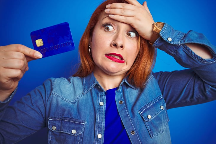 Upset woman with credit card