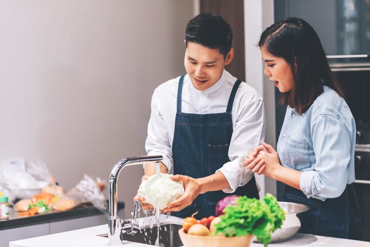 couple washing produce