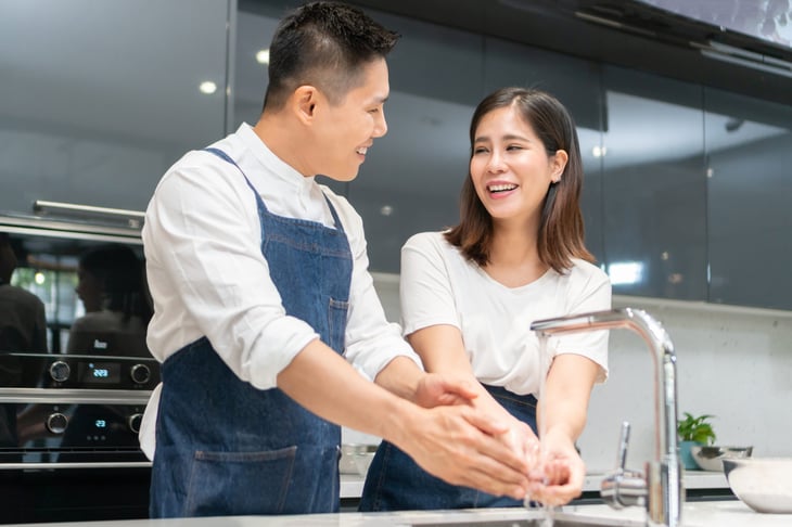 couple washing hands