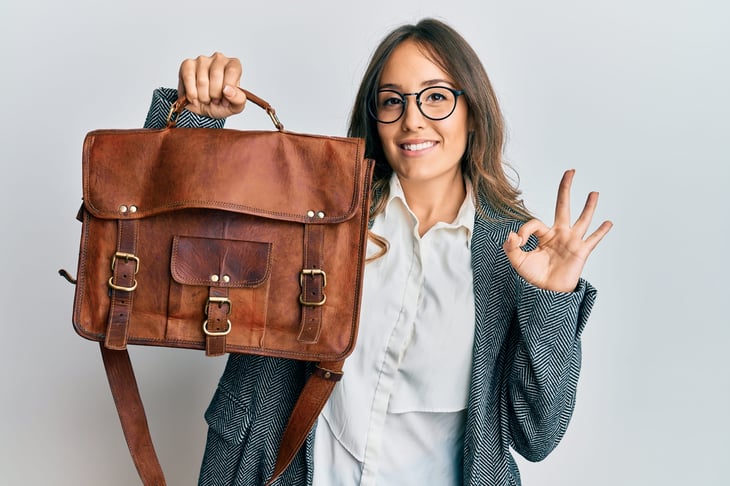Woman holding leather bag