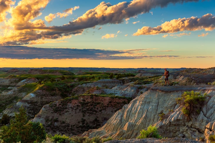 A hiker in Theodore Roosevelt National Park in North Dakota