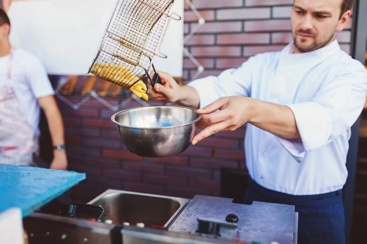 restaurant chef cooking french fries outdoors
