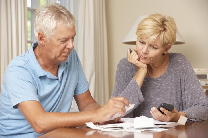Senior couple examining their finances