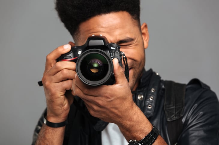 man taking a photograph