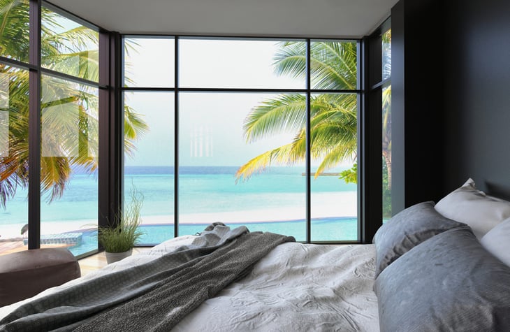 bedroom interior palm tree ocean view out window