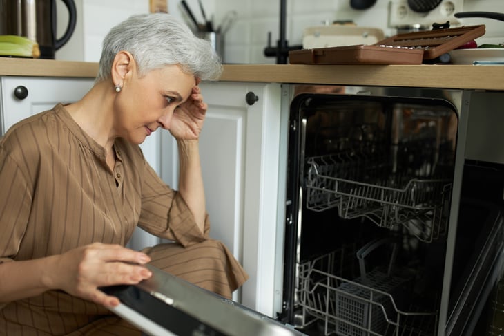 Woman upset by her dishwasher