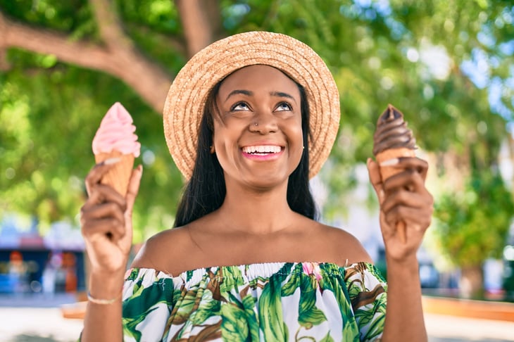 Woman holding ice cream cones