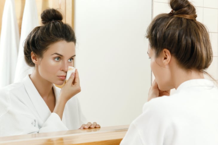 Woman removing makeup