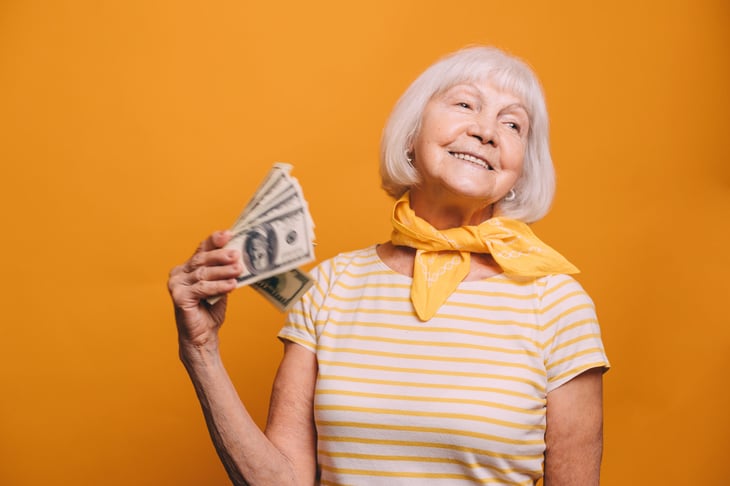 Senior woman holding money